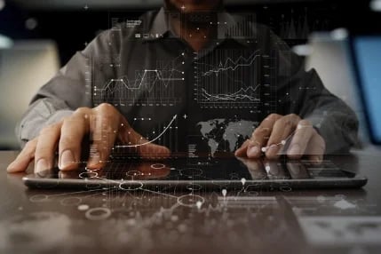 businessman hand working on laptop computer with digital layer business strategy and social media diagram on wooden desk-1-1