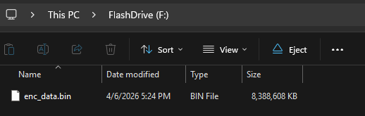 Windows File Explorer showing the NTFS flash drive with the enc_data.bin encrypted file container visible