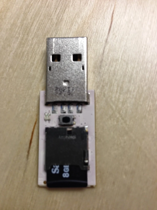 Rubber ducky HID device disassembled showing the microSD card slot and circuit board inside